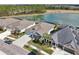 Aerial view of houses backing to lake at 4594 Tour Trce, Land O Lakes, FL 34638