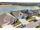 Aerial view of homes and community, showcasing lakeside living at 4594 Tour Trce, Land O Lakes, FL 34638