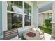 Cozy front porch with seating and a view of the neighborhood at 4594 Tour Trce, Land O Lakes, FL 34638