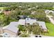 Aerial view of a well-maintained community, highlighting the serene pond and lush surroundings at 4620 Hidden View Pl # 10, Sarasota, FL 34235