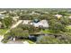 Aerial view of the property featuring mature trees, landscaping and a peaceful pond at 4620 Hidden View Pl # 10, Sarasota, FL 34235