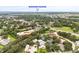 Aerial view showcasing the property's location near downtown Sarasota and lush surroundings, pond and fountain at 4620 Hidden View Pl # 10, Sarasota, FL 34235