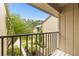 Balcony offering views of lush landscaping and the surrounding neighborhood at 4620 Hidden View Pl # 10, Sarasota, FL 34235