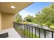 Balcony view of lake and landscaping, with a ceiling light at 4620 Hidden View Pl # 10, Sarasota, FL 34235