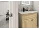 Bathroom featuring marble countertop vanity, black faucet and view of the walk-in closet at 4620 Hidden View Pl # 10, Sarasota, FL 34235