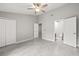 Spacious bedroom featuring tile floors, closet and a door to the bathroom at 4620 Hidden View Pl # 10, Sarasota, FL 34235