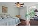 Bedroom featuring hardwood floors, neutral color walls, and a ceiling fan at 4810 W San Miguel St, Tampa, FL 33629