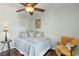 Bedroom featuring hardwood floors, neutral color walls, and a ceiling fan at 4810 W San Miguel St, Tampa, FL 33629