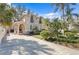 Beautiful two-story home featuring manicured landscaping and a long driveway at 4810 W San Miguel St, Tampa, FL 33629