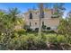 Exterior of home featuring lush landscaping, manicured bushes and beautiful facade at 4810 W San Miguel St, Tampa, FL 33629