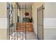 View of the home's front entrance through a black wrought iron gate and steps at 4810 W San Miguel St, Tampa, FL 33629