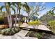 Backyard deck with a pergola, providing shade and space for outdoor entertaining overlooking the serene waterway at 4811 Paradise S Way, St Petersburg, FL 33705