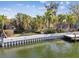 Waterfront property with lush, tropical landscaping and private dock at 4811 Paradise S Way, St Petersburg, FL 33705