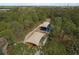 Aerial view of a playground, nestled among the trees and featuring a covered play area at 512 Oceanview Ave, Palm Harbor, FL 34683