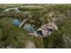 Scenic aerial shot of a park, showcasing a wooden bridge and walkways surrounded by trees at 512 Oceanview Ave, Palm Harbor, FL 34683