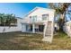 Spacious backyard featuring a deck, patio, outdoor seating, and well-maintained lawn at 512 Oceanview Ave, Palm Harbor, FL 34683