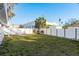 A large backyard with a white fence at 512 Oceanview Ave, Palm Harbor, FL 34683