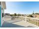 Balcony with white railing offers views of the neighborhood homes at 512 Oceanview Ave, Palm Harbor, FL 34683