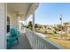 Balcony view with white railing, outdoor seating and views of the neighborhood at 512 Oceanview Ave, Palm Harbor, FL 34683