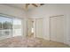 Bright bedroom with large sliding glass doors and two closets offers ample natural light and storage at 512 Oceanview Ave, Palm Harbor, FL 34683