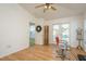 Bright bedroom with french doors to a balcony and additional entrance is airy and inviting at 512 Oceanview Ave, Palm Harbor, FL 34683