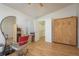 Bright bedroom with french doors and a murphy bed offers flexible living space at 512 Oceanview Ave, Palm Harbor, FL 34683