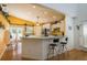 Bright kitchen with white cabinetry, modern appliances, and breakfast bar at 512 Oceanview Ave, Palm Harbor, FL 34683