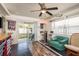 A recreation room with a bar, seating, and sliding doors to the backyard at 512 Oceanview Ave, Palm Harbor, FL 34683