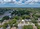 Aerial view of the property, showing its location in a residential neighborhood with mature trees and nearby amenities at 5504 60Th N Way, St Petersburg, FL 33709