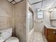 A full bathroom with a shower/tub, sink, and tiled walls at 5504 60Th N Way, St Petersburg, FL 33709