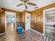 Cozy eat-in kitchen with wood paneling, tile flooring, and ample storage space at 5504 60Th N Way, St Petersburg, FL 33709