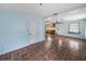 A cozy living room with tile flooring, leading into the kitchen at 5504 60Th N Way, St Petersburg, FL 33709