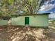 Exterior of a shed with green door at 5504 60Th N Way, St Petersburg, FL 33709