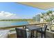 Condo balcony featuring a dining area, built-in grill, and scenic waterfront views at 5701 Mariner St # 606, Tampa, FL 33609