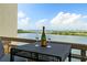 Enjoy the beautiful water view from this balcony, set with a table and champagne at 5701 Mariner St # 606, Tampa, FL 33609