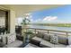 Balcony showcasing comfortable seating, plants, and scenic waterfront views on a sunny day at 5701 Mariner St # 606, Tampa, FL 33609