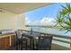 Cozy balcony with a built-in grill and views of the water and city skyline at 5701 Mariner St # 606, Tampa, FL 33609