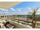 Inviting balcony with seating, a beautiful view, and lush greenery at 5701 Mariner St # 606, Tampa, FL 33609