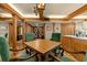 Dining area featuring hardwood floors, decorative wood columns and green upholstered chairs at 5701 Mariner St # 606, Tampa, FL 33609