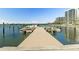 Waterfront community dock with boats against a backdrop of buildings and nature at 5701 Mariner St # 606, Tampa, FL 33609