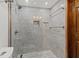 Elegant shower with stylish tile, glass enclosure, and modern fixtures at 5701 Mariner St # 606, Tampa, FL 33609