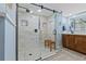 Contemporary shower with a glass door, bench, and modern fixtures at 5701 Mariner St # 606, Tampa, FL 33609