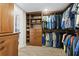 Spacious walk-in closet with custom built-in shelving and drawers for optimal storage at 5701 Mariner St # 606, Tampa, FL 33609