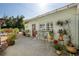 Cozy backyard patio with potted plants, a bench, and string lights for a relaxing outdoor space at 6342 5Th N Ave, St Petersburg, FL 33710