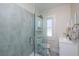 Tastefully renovated bathroom offering a glass shower, sleek vanity, and modern fixtures; bright and stylish at 6342 5Th N Ave, St Petersburg, FL 33710