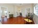 Bright dining room with hardwood floors, a glass table, and views into adjacent rooms at 6342 5Th N Ave, St Petersburg, FL 33710