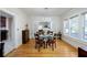 Elegant dining area with a glass table, hardwood floors, and stylish decor at 6342 5Th N Ave, St Petersburg, FL 33710