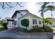 Two-story house with well-kept landscaping, showcasing its distinctive architectural style at 6342 5Th N Ave, St Petersburg, FL 33710