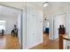 Hallway with hardwood floors that connects to rooms and the second floor stairway at 6342 5Th N Ave, St Petersburg, FL 33710