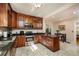 Well-lit kitchen featuring stainless steel appliances, dark granite counters, and wood cabinets at 6342 5Th N Ave, St Petersburg, FL 33710